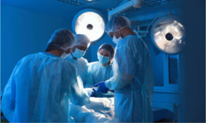 A group of surgeons performing an operation.