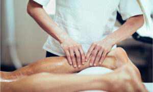 An athlete having a massage after surgery to quicken healing process.